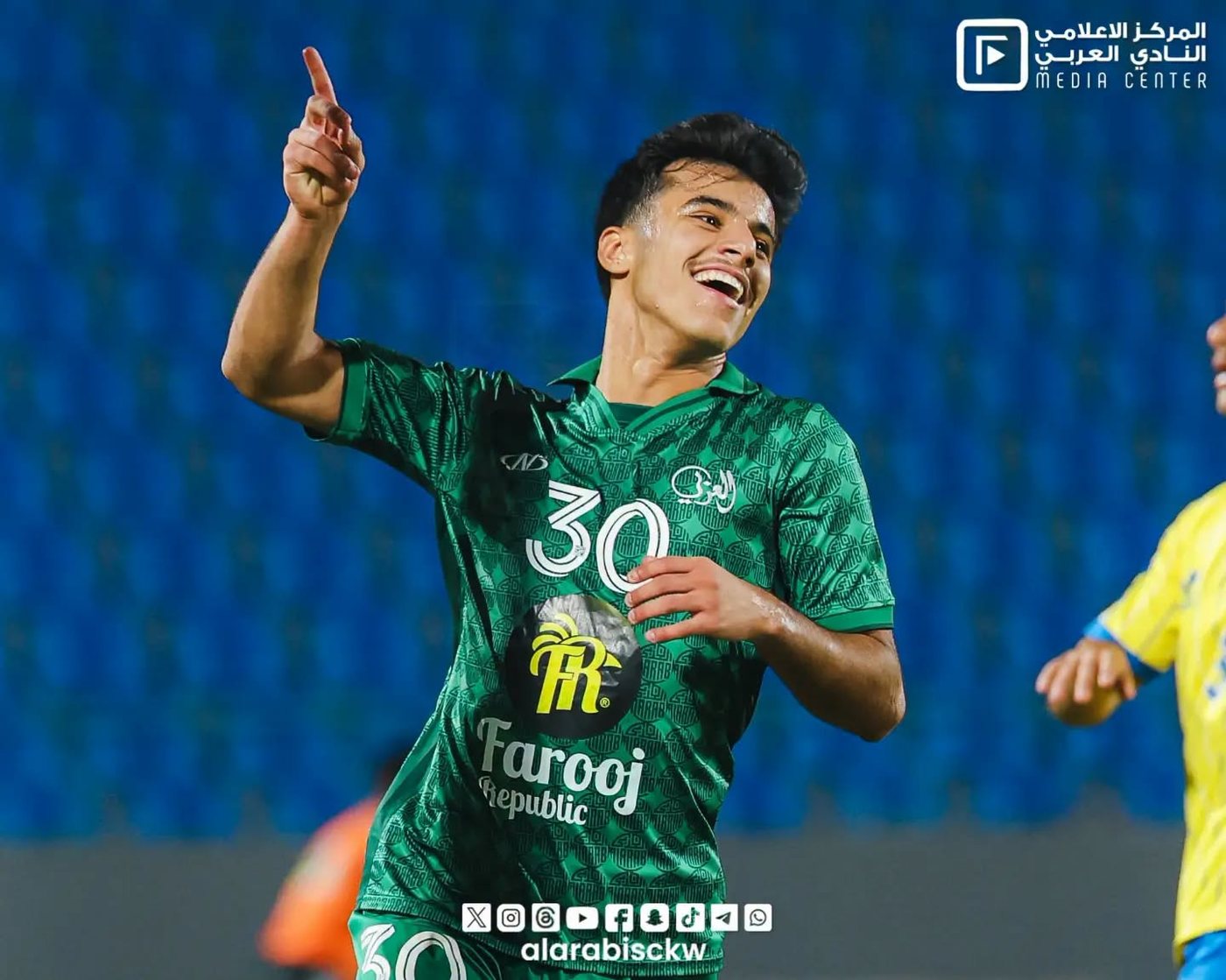 Al Arabi SC player celebrating a goal in a Farooj Republic shirt